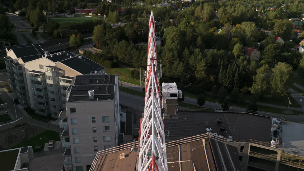 Flying over a flat-top construction crane's counterweight, counter jib and working jib