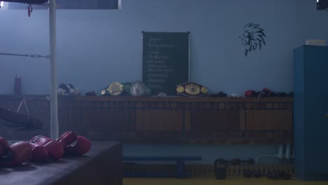 boxing gym interior with trophies and training schedule