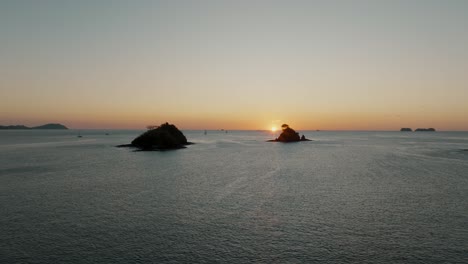 flight over sea and islets during dusk near guanacaste beach in costa rica, central america