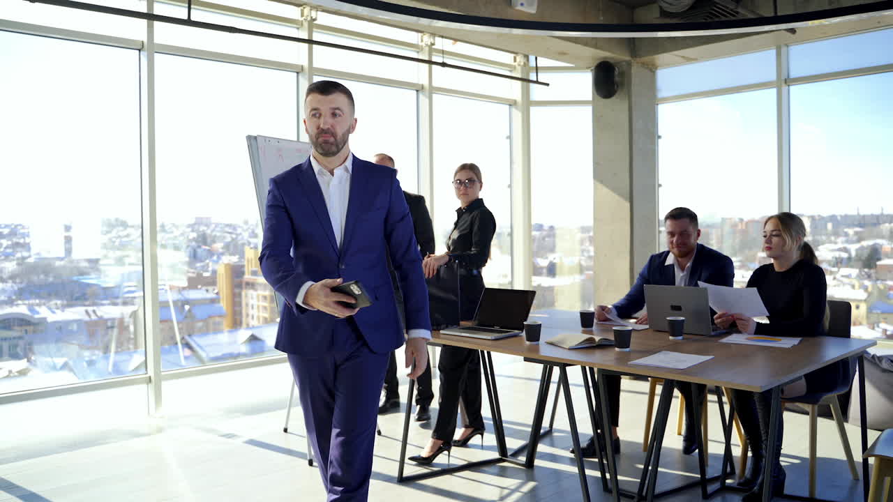 Successful meeting of business people, discussing new business ideas, using diagrams, sitting together. Meeting of business partners at the conference on business development