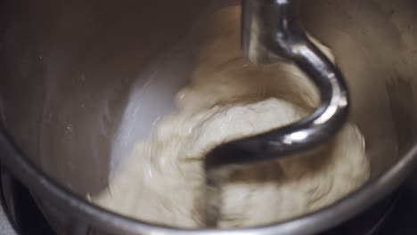 Kneading-the-pizza-dough-in-big-kitchen-mixer