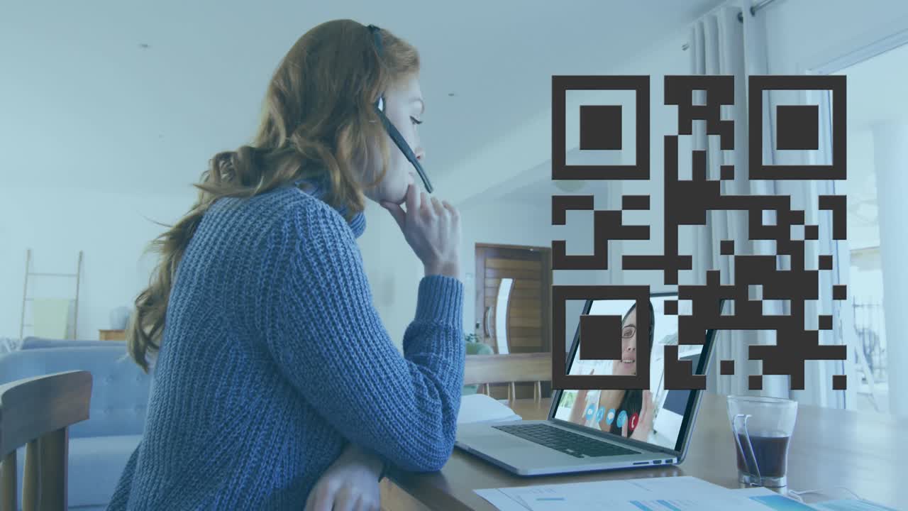 Animation of qr code over caucasian woman having video call on laptop