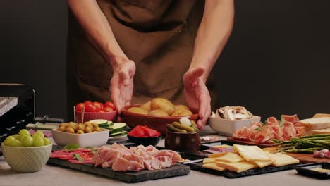 italian or spanish restaurant with traditional tapas food, spanish cuisine, delicious tapas and cheese plate, bruschetta with cheese, olives dry tomatoes and tasty sandwich bar appetizer, buffet