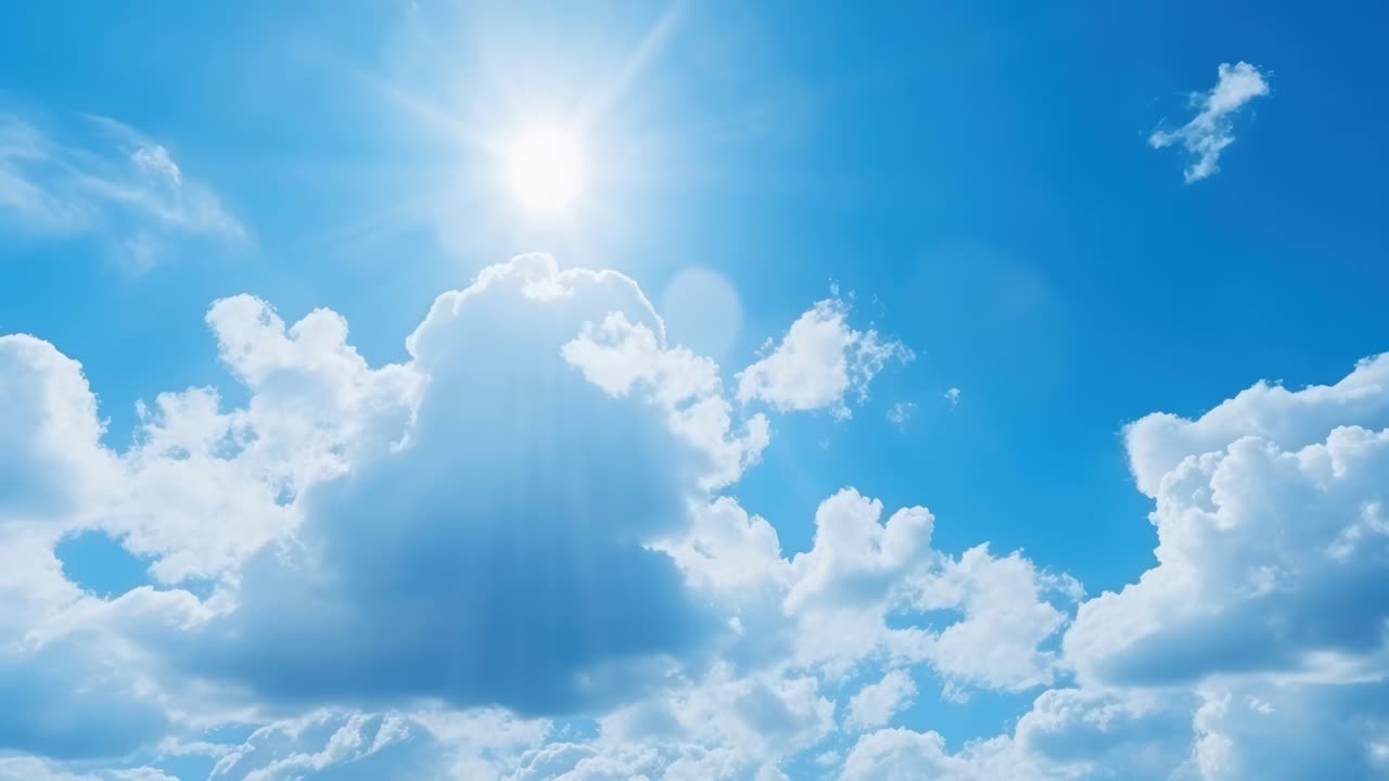 A serene video captures a wide-angle view of a bright blue sky with fluffy clouds and a radiant sun