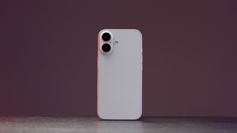 back view of a white smartphone with dual cameras