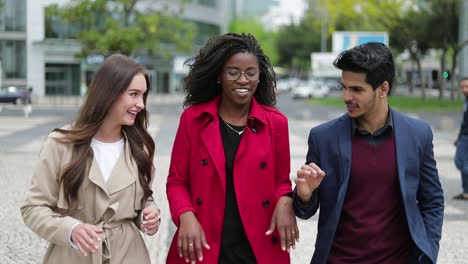 young people walking along street, talking, sharing emotions