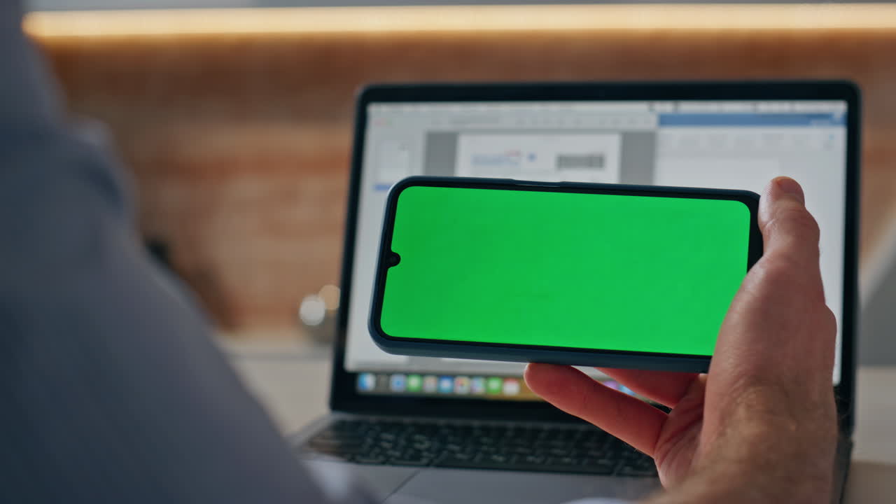 Man hands hold chromakey phone office closeup. Businessman reading green screen