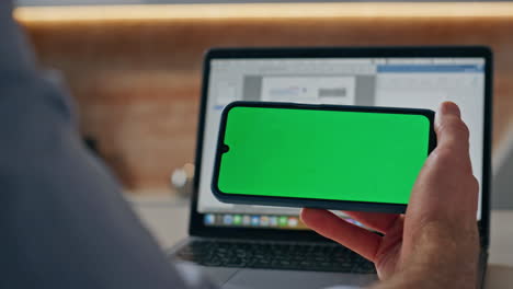 man hands hold chromakey phone office closeup. businessman reading green screen