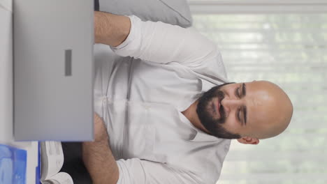 Vertical-video-of-Home-office-worker-man-dance-and-work.