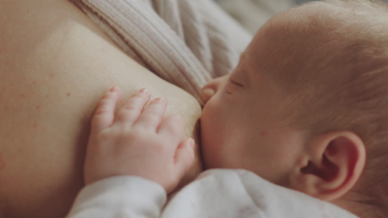 Mother Breastfeeding Newborn Baby