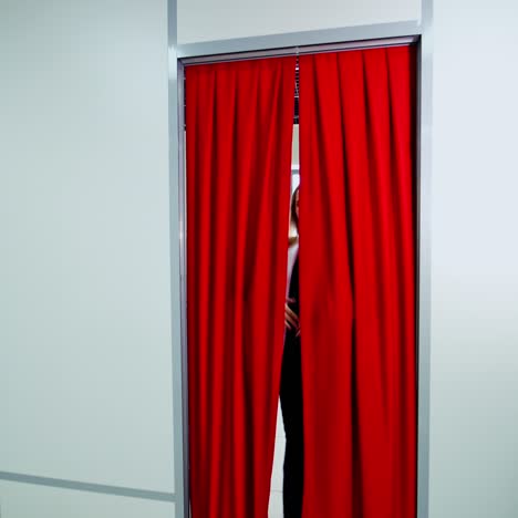 woman in fitting room of shop