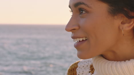 close up portrait of beautiful happy woman enjoying freedom exploring spirituality feeling joy on peaceful beach at sunset with wind blowing hair