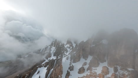 Majestic-aerial-view-of-the-mist-covered-Latemar-Mountains-in-Trentino-during-winter