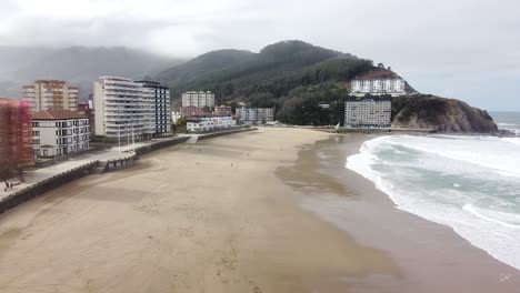 Aerial-drone-view-of-the-beach-of-Bakio-in-the-Basque-Country-in-a-foggy-day