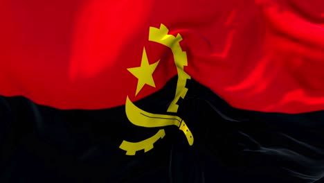 bandera de angola ondeando en el viento animación en cámara lenta. 4k textura de tela realista bandera soplando suavemente en un día de viento fondo de bucle continuo sin costuras.