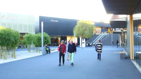 luxury shopping mall exterior with people