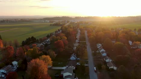 Gorgeous-rising-aerial-features-residential-homes,-houses-along-street