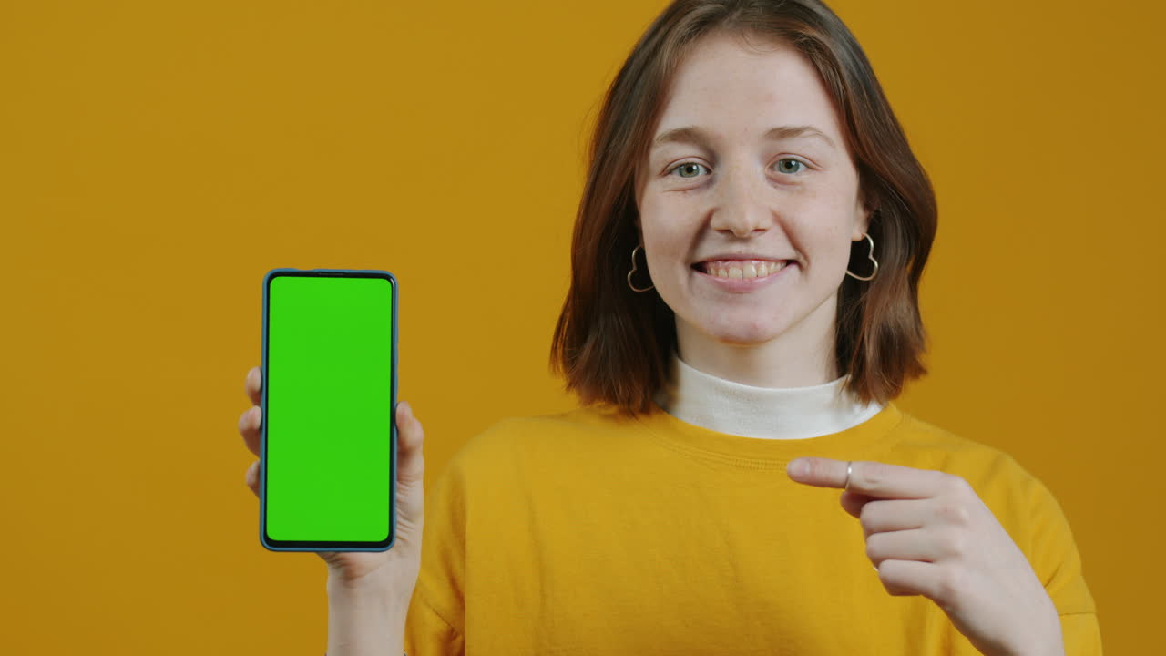 Woman Showing Green Screen Phone