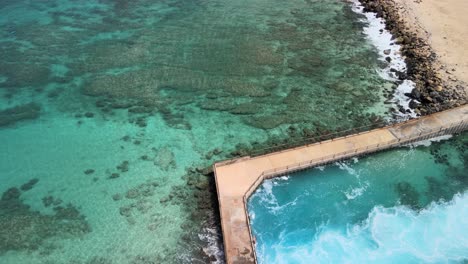 Aerial-view-of-electric-beach-on-Oahu-Hawaii