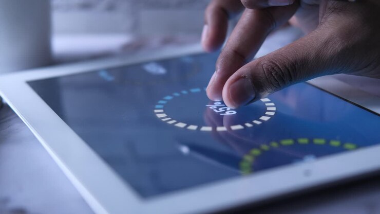 Hand Touching a Progress Circle on a Tablet