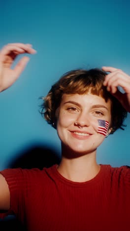 young woman with american flag face paint