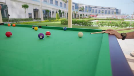 billiard competition between young men in the hall insert shot, tracking shot