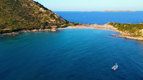 flying over turquoise water of punta molentis beach, villasimius, sardinia, italy