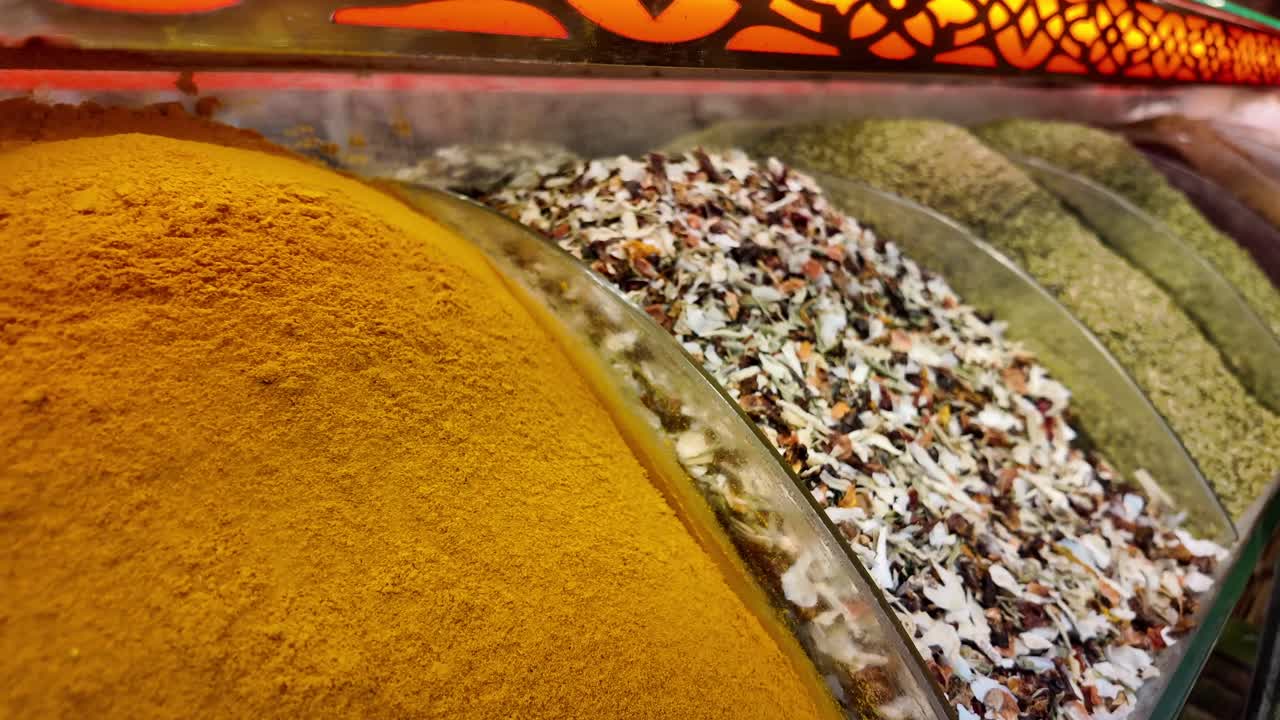 Close-up of Vibrant Spices and Herbs in a Market Stall
