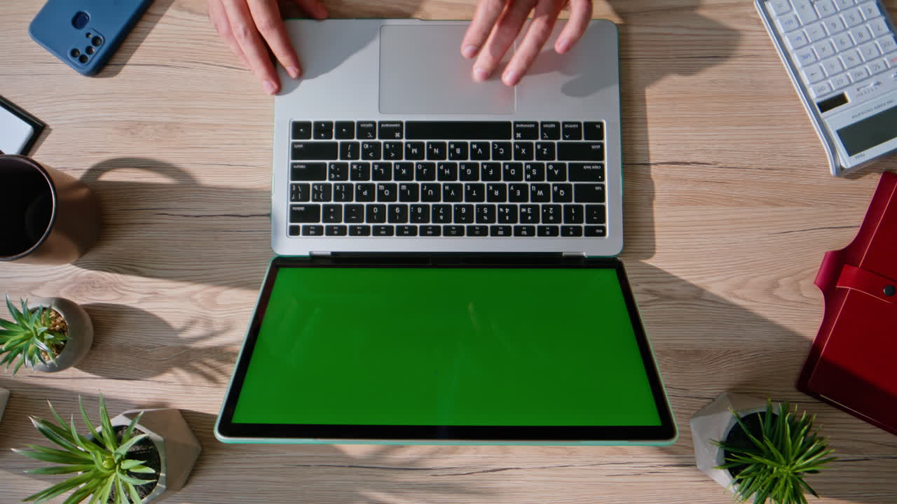 Remote worker browsing mockup laptop at modern office desk closeup top view