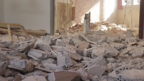 piles of concrete debris on the floor of demolished apartment