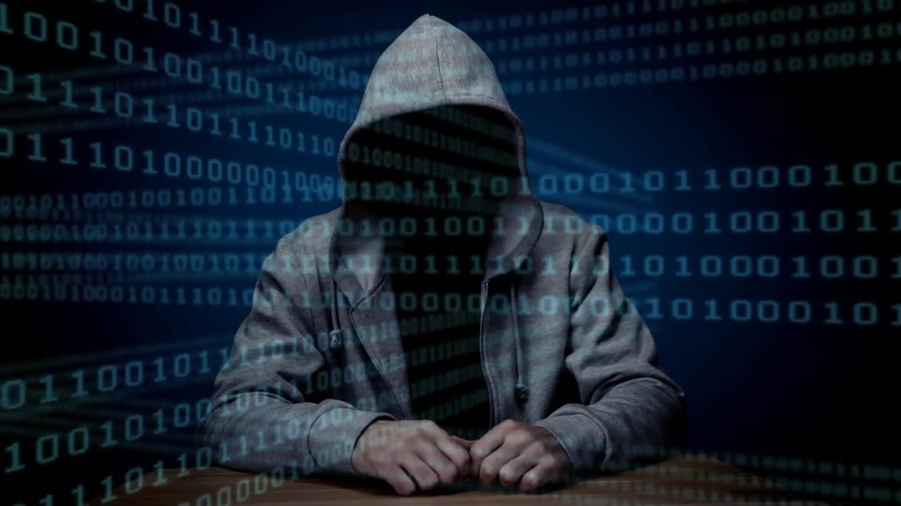 animación digital de hacker sentado en la mesa 4k