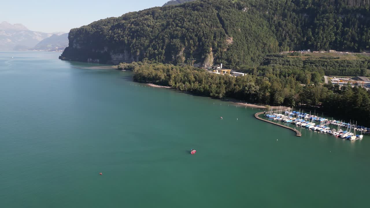 Beautiful drone footage of marina that leads to long river that winding through the mountains