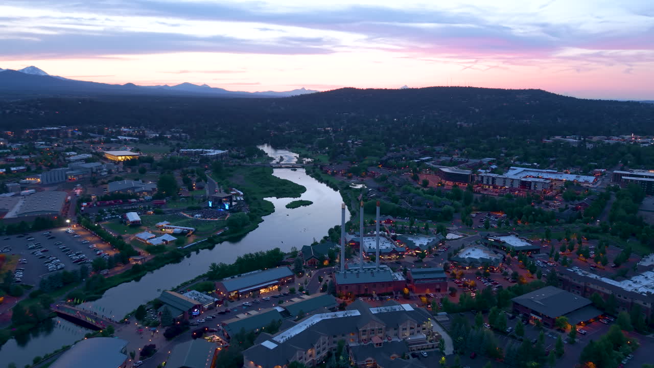 Drone shot of Old Mill District with restaurants and businesses in Bend, Oregon.