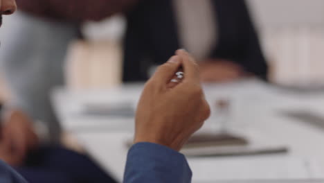 close up businessman hand holding pen brainstorming ideas thinking of strategy making decision in boardroom meeting