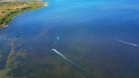 Scenic-drone-shot-of-Punta-Trettu-kite-beach,-Sardinia,-Italy