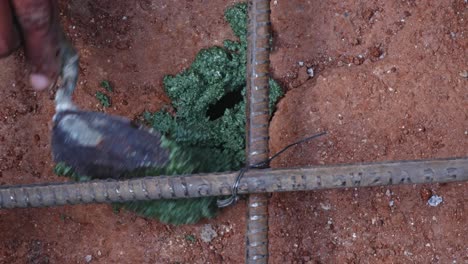 lokfix p chemical filling in drilled rock hole to fix rebar for footing at construction site. day time, zoom in shot, 4k