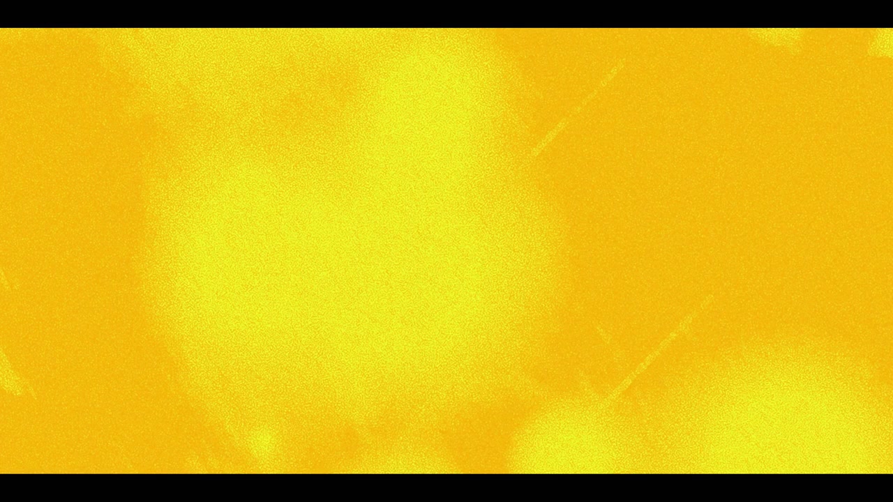 Sfondo giallo astratto con texture a grana di pellicola