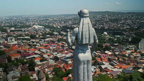 kartlis deda (mother of georgia) statue overlooking tbilisi cityscape