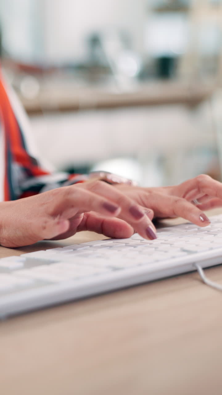 Close-up of Woman's Hands Typing on a Computer Keyboard