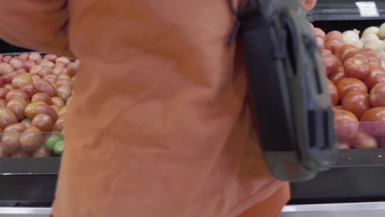 Fresh vegetables neatly arranged at a grocery store with vibrant colors and variety on display