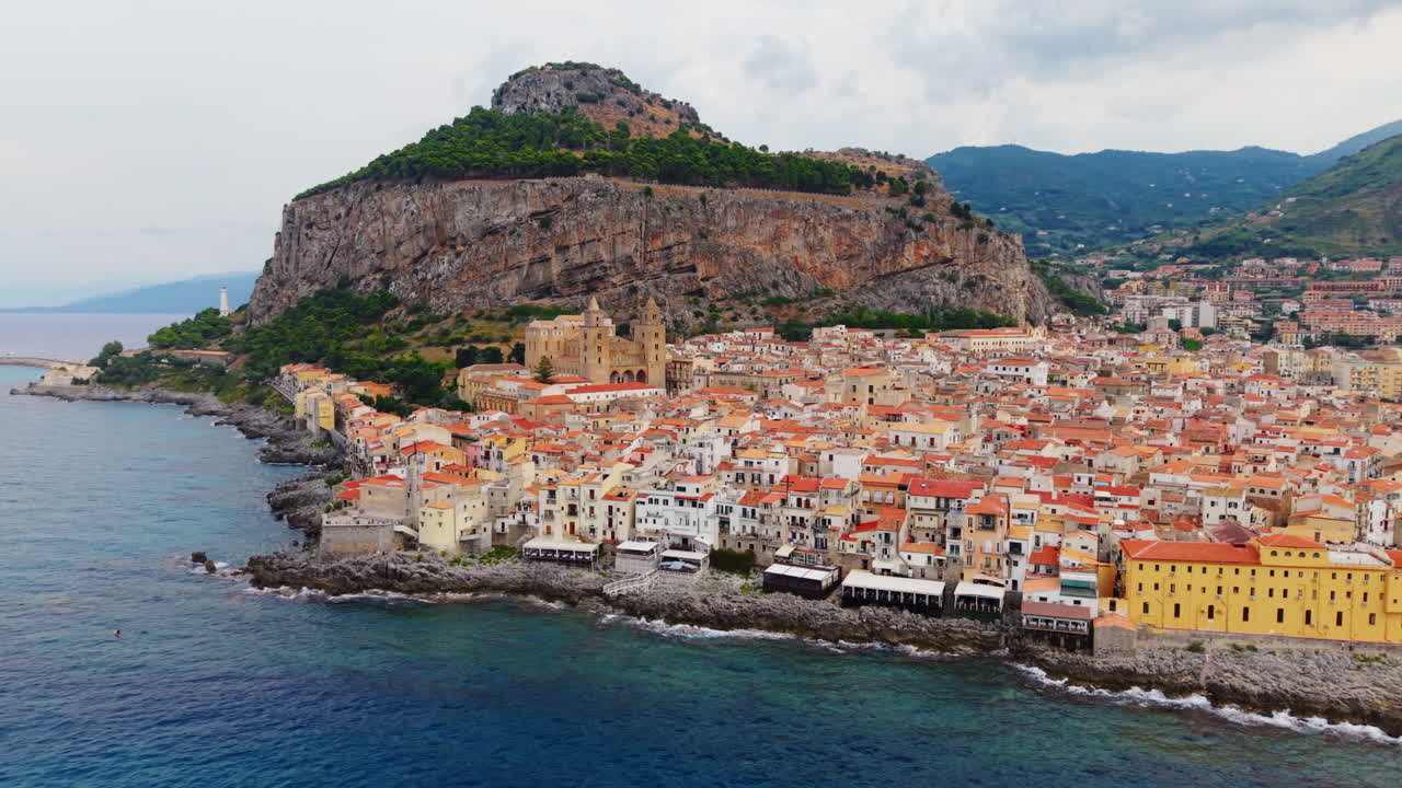 Coastal town Cefalù, Sicily, with majestic sea and historic architecture