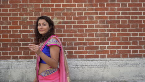 woman celebrating deepavali festival of lights in the street - slow motion