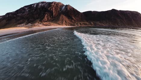 Ocean-waves,-beach-and-mountains-in-Hoddevik,-aerial-view