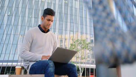 Male-commuter-using-laptop-in-office-premises-4k