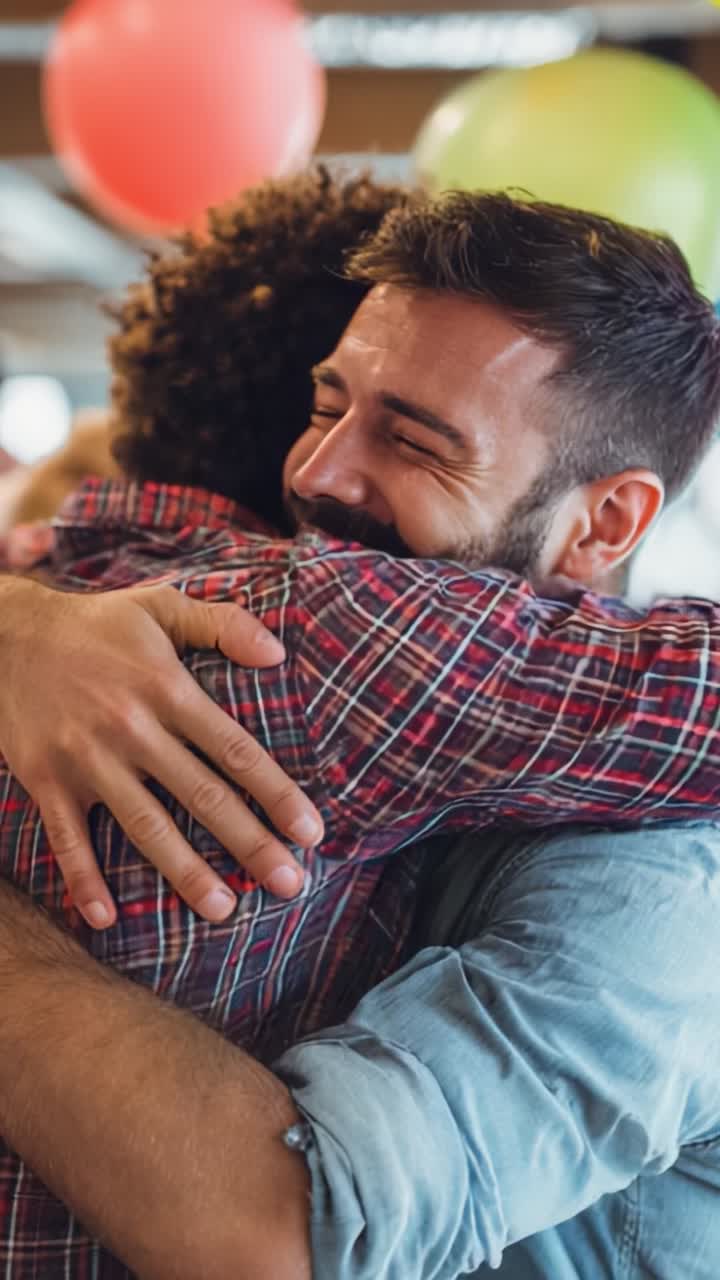 Joyful Reunion: Two Friends Embrace Happily Amidst Colorful Balloons in a Celebratory Atmosphere, Sharing Warmth and Connection in This Heartfelt Moment