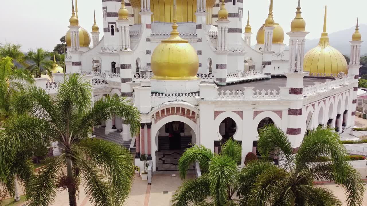zoom out drone shot of malaysian muslim mosque masjid in Kuala Kangsar Perak