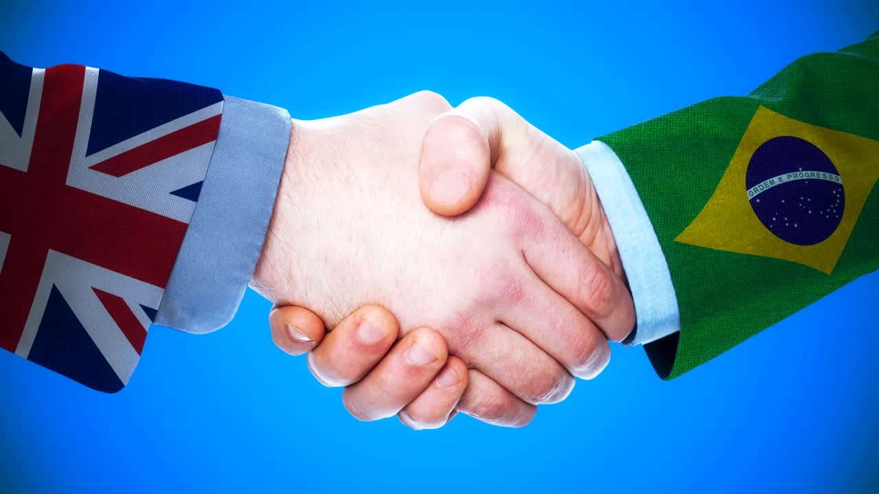 reino unido - brasil apretón de manos concepto de animación sobre países y política con el canal matte /