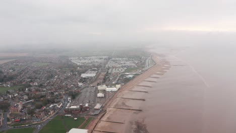 Circling-descending-drone-shot-of-sea-defences-on-the-UK-coast