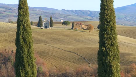 a beautiful farmhouse and church in tuscany italy 2