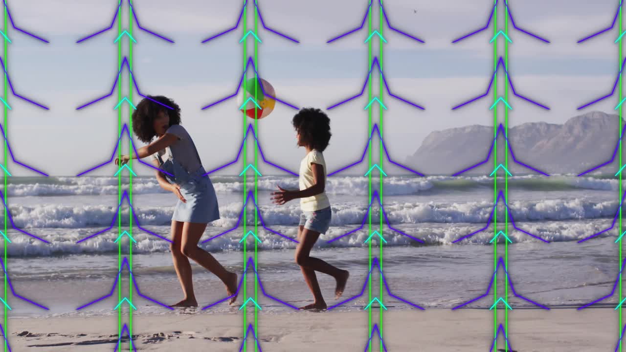 Two people walking on beach with geometric pattern animation overlay